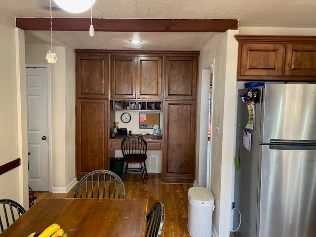 1413 S Oak St, Pecos, TX 79772 - dining space with baseboards and dark wood-style flooring