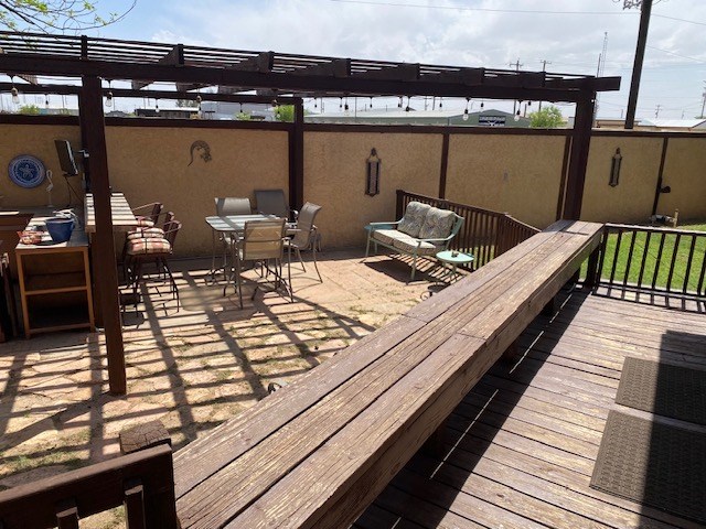 1413 S Oak St, Pecos, TX 79772 - wooden terrace featuring a pergola