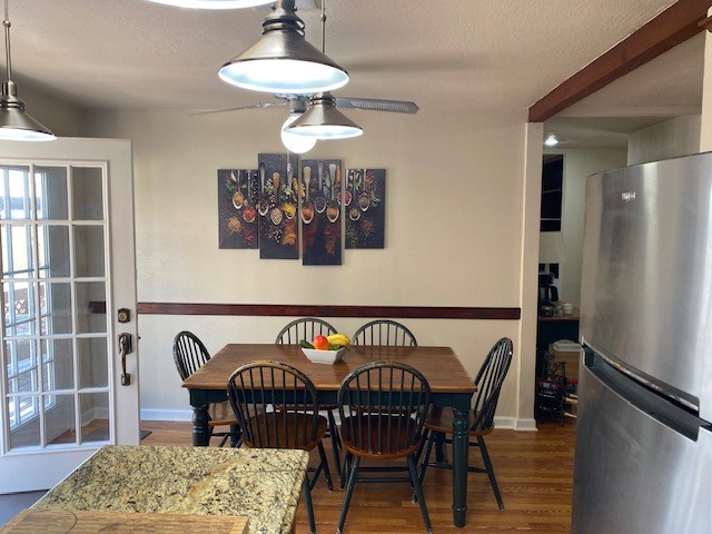 1413 S Oak St, Pecos, TX 79772 - dining room featuring baseboards and wood finished floors