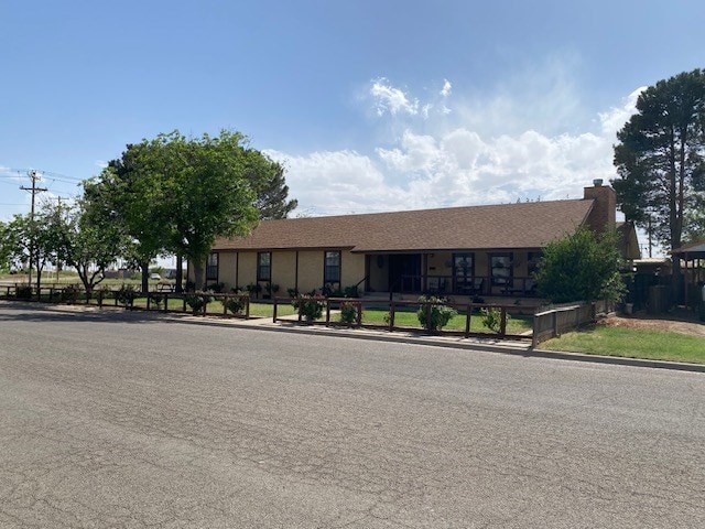 1413 S Oak St, Pecos, TX 79772 - ranch-style house with a chimney