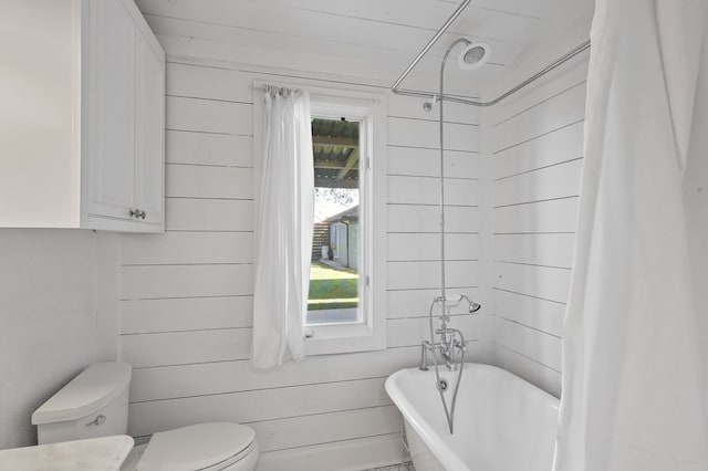 201 S Front St, Fort Davis, TX 79734 - full bath with a soaking tub, wood walls, and curtained shower