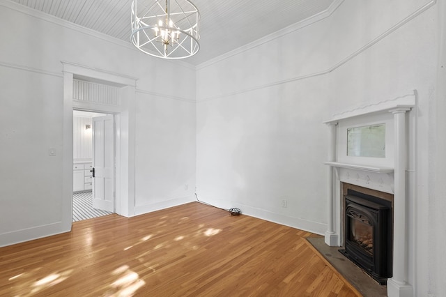 201 S Front St, Fort Davis, TX 79734 - unfurnished living room with crown molding, light wood-style floors, a chandelier, and a fireplace with flush hearth