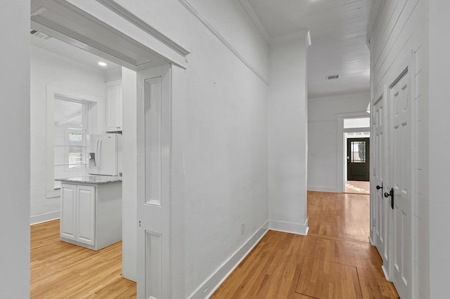 201 S Front St, Fort Davis, TX 79734 - hall with light wood finished floors, ornamental molding, and recessed lighting