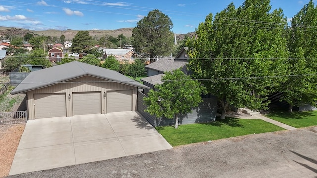 201 S Front St, Fort Davis, TX 79734 - view of front of home featuring a garage, concrete driveway, and a mountain view