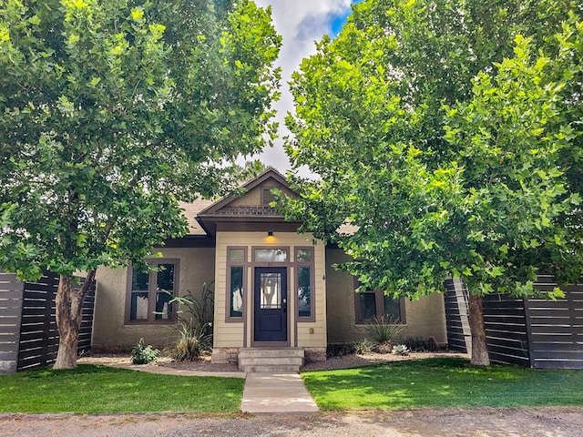 201 S Front St, Fort Davis, TX 79734 - view of front of property featuring stucco siding and a front lawn