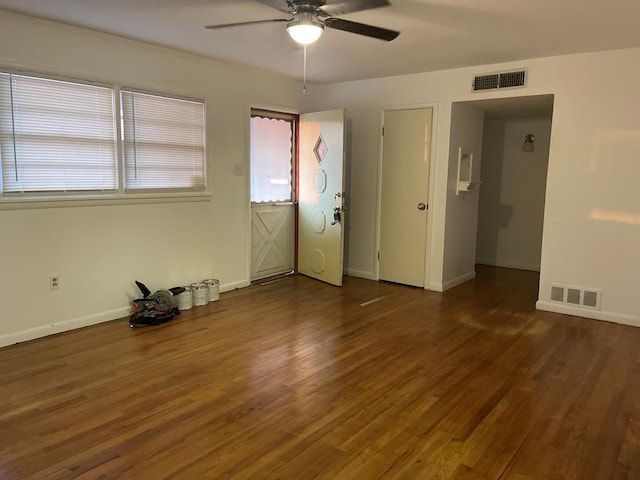 1704 E 12th St, Odessa, TX 79761 - unfurnished room with ceiling fan, wood finished floors, and baseboards