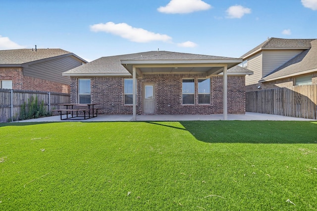 7410 W Pile Ranch Rd, Odessa, TX 79765 - rear view of house featuring a patio area, brick siding, a fenced backyard, and roof with shingles