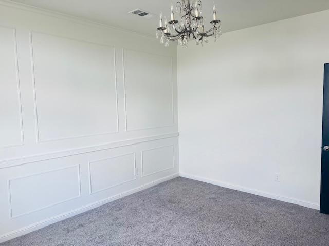 7410 W Pile Ranch Rd, Odessa, TX 79765 - unfurnished room featuring a chandelier and carpet