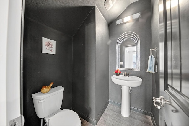 7410 W Pile Ranch Rd, Odessa, TX 79765 - bathroom with wood finished floors and lofted ceiling