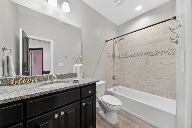 7410 W Pile Ranch Rd, Odessa, TX 79765 - full bathroom with vanity, bathtub / shower combination, and wood finished floors