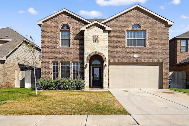 7410 W Pile Ranch Rd, Odessa, TX 79765 - view of front of house with brick siding, an attached garage, concrete driveway, and stone siding