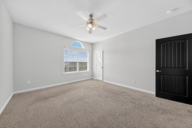 7410 W Pile Ranch Rd, Odessa, TX 79765 - empty room featuring a smoke detector, a ceiling fan, and carpet