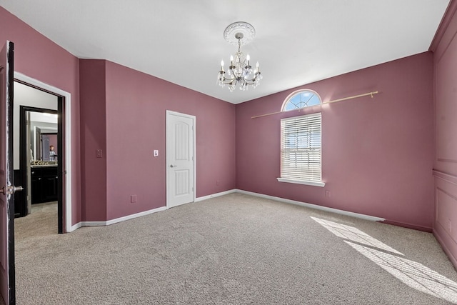 7410 W Pile Ranch Rd, Odessa, TX 79765 - carpeted empty room featuring a chandelier and baseboards