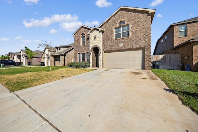 7410 W Pile Ranch Rd, Odessa, TX 79765 - view of front of home with an attached garage, brick siding, concrete driveway, and a residential view