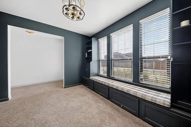 7410 W Pile Ranch Rd, Odessa, TX 79765 - unfurnished room featuring light carpet, plenty of natural light, and a chandelier