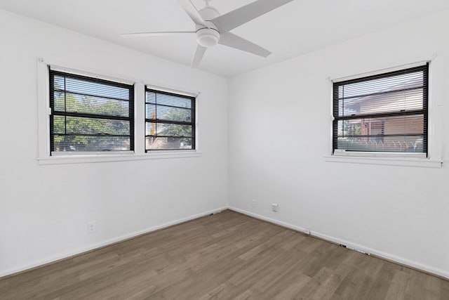 3633 Melody Ln, Odessa, TX 79762 - empty room featuring wood finished floors, plenty of natural light, and ceiling fan