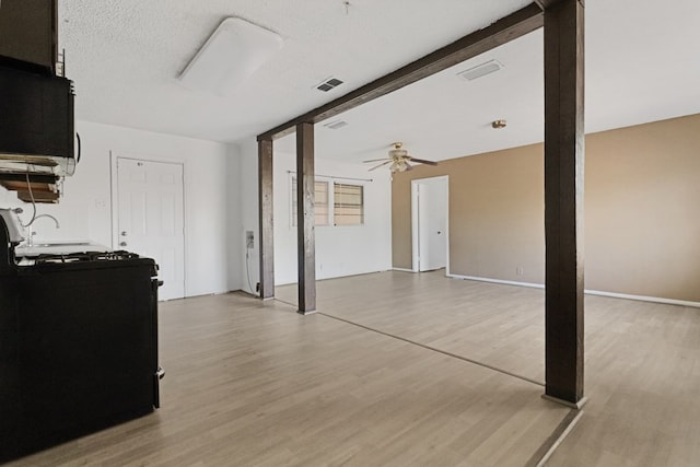 3633 Melody Ln, Odessa, TX 79762 - unfurnished living room with light wood-type flooring and ceiling fan