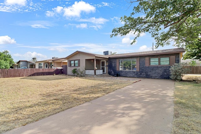 3633 Melody Ln, Odessa, TX 79762 - ranch-style home with stone siding and driveway