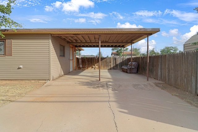 3633 Melody Ln, Odessa, TX 79762 - view of car parking featuring an attached carport and concrete driveway