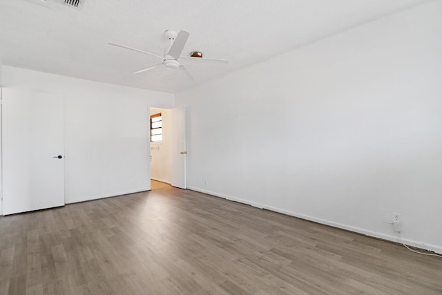 3633 Melody Ln, Odessa, TX 79762 - unfurnished room featuring wood finished floors and a ceiling fan