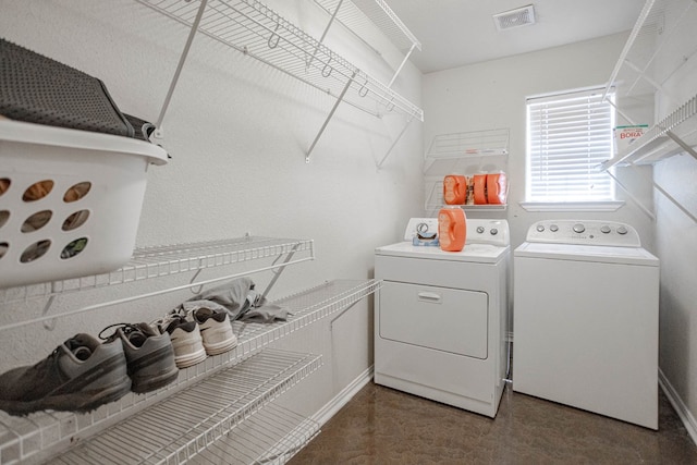 6921 Stonehenge Rd, Odessa, TX 79765 - laundry room with washing machine and clothes dryer and baseboards