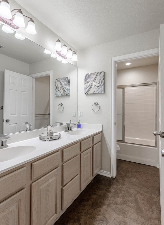 6921 Stonehenge Rd, Odessa, TX 79765 - bathroom featuring double vanity and shower / bath combination with glass door