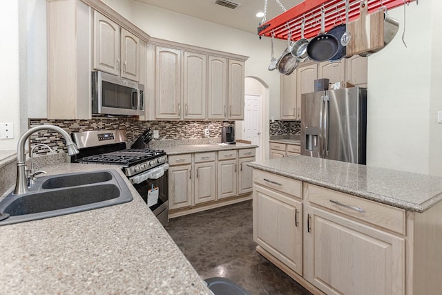 6921 Stonehenge Rd, Odessa, TX 79765 - kitchen featuring stainless steel appliances, tasteful backsplash, and light countertops