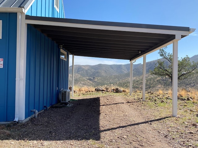 104 Low Meadow Pt, Fort Davis, TX 79734 - exterior space with ac unit, a mountain view, and an attached carport