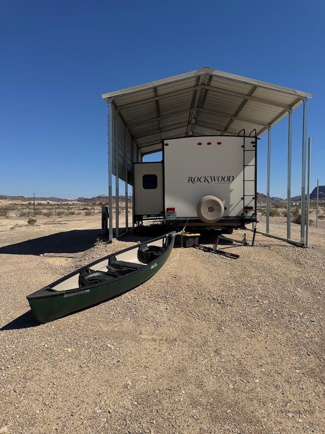 287 Fulcher Rd, Terlingua, TX 79852 - view of parking featuring a carport and a mountain view