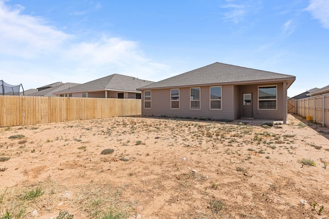 back of house featuring a fenced backyard