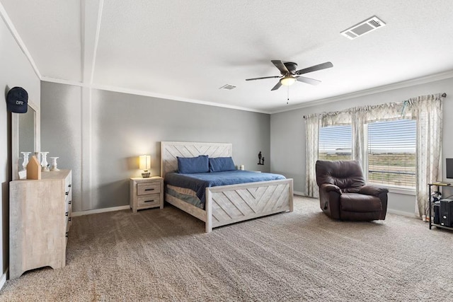 bedroom featuring ceiling fan, carpet floors, and ornamental molding