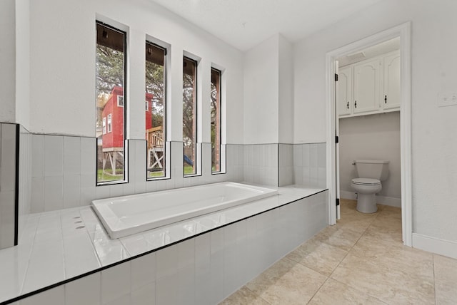 20 Sunnygrove Dr, Odessa, TX 79761 - bathroom featuring a garden tub and tile patterned floors