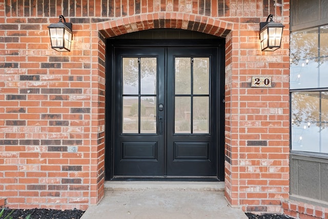 20 Sunnygrove Dr, Odessa, TX 79761 - view of exterior entry featuring french doors and brick siding