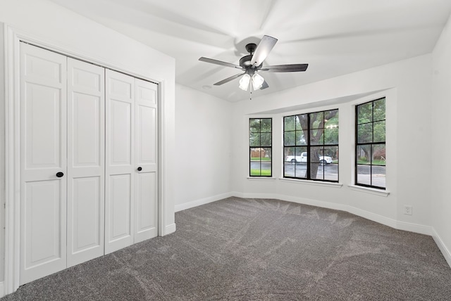 20 Sunnygrove Dr, Odessa, TX 79761 - unfurnished bedroom featuring carpet, multiple windows, a closet, and ceiling fan