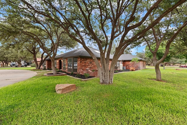 20 Sunnygrove Dr, Odessa, TX 79761 - view of front of property featuring a front lawn and brick siding
