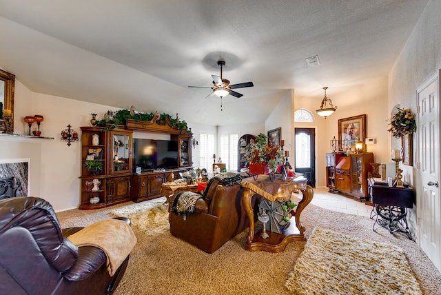 6920 Stonehenge Rd, Odessa, TX 79765 - carpeted living room featuring ceiling fan and lofted ceiling
