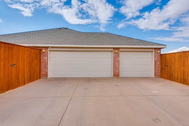 6920 Stonehenge Rd, Odessa, TX 79765 - garage featuring concrete driveway and fence