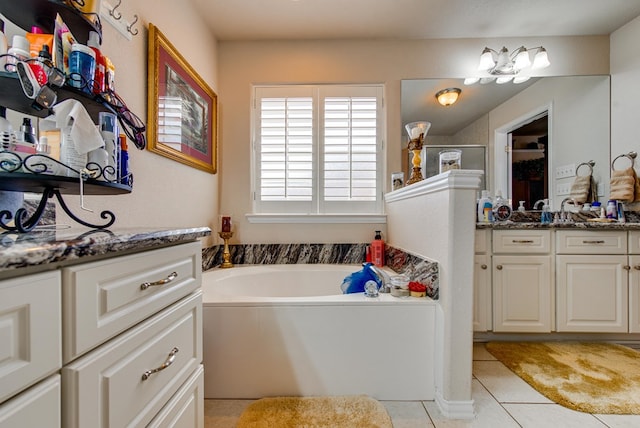 6920 Stonehenge Rd, Odessa, TX 79765 - full bath featuring vanity, tile patterned flooring, a bath, and a walk in shower
