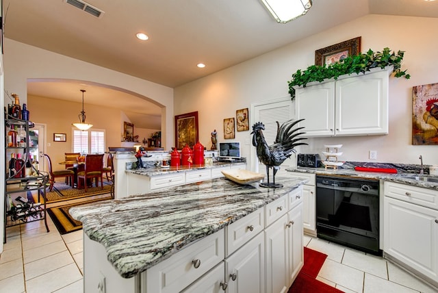 6920 Stonehenge Rd, Odessa, TX 79765 - kitchen featuring black dishwasher, arched walkways, a kitchen island, light tile patterned flooring, and recessed lighting