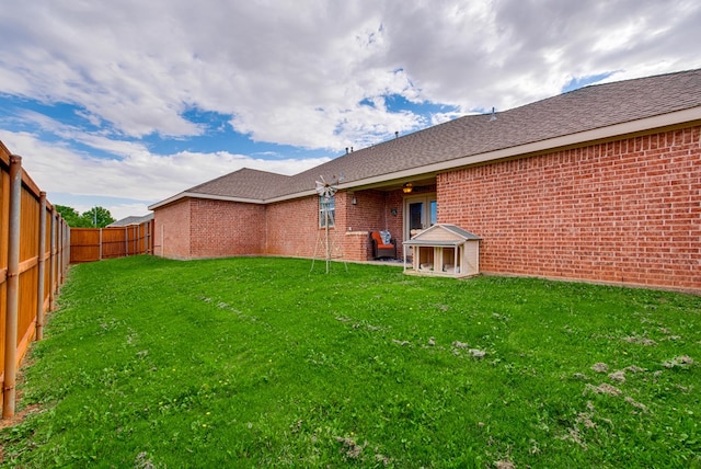 6920 Stonehenge Rd, Odessa, TX 79765 - rear view of house featuring brick siding and roof with shingles
