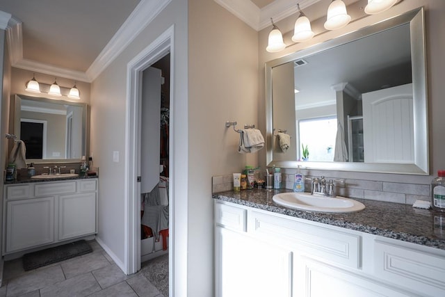 1322 E 89th St, Odessa, TX 79765 - bathroom with ornamental molding, vanity, tile patterned flooring, a shower with shower door, and baseboards