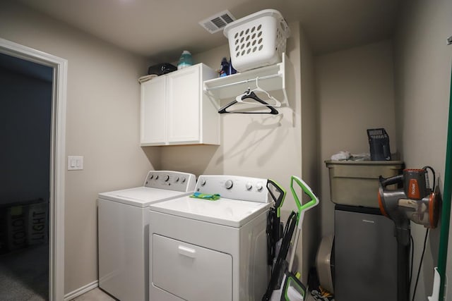 1322 E 89th St, Odessa, TX 79765 - laundry area featuring independent washer and dryer and cabinet space