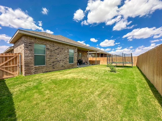 1322 E 89th St, Odessa, TX 79765 - view of yard with a trampoline