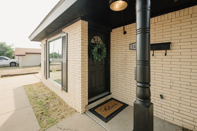 1613 E 52nd St, Odessa, TX 79762 - property entrance featuring brick siding
