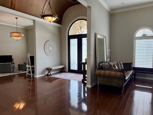 5 Muirfield Dr, Odessa, TX 79762 - foyer featuring plenty of natural light, dark wood-style floors, arched walkways, and a high ceiling