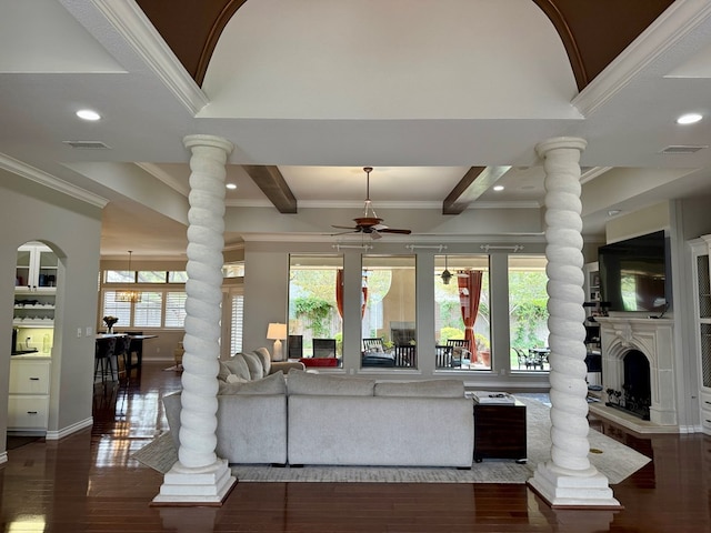 5 Muirfield Dr, Odessa, TX 79762 - living area with decorative columns, ceiling fan, hardwood / wood-style flooring, a fireplace with raised hearth, and crown molding