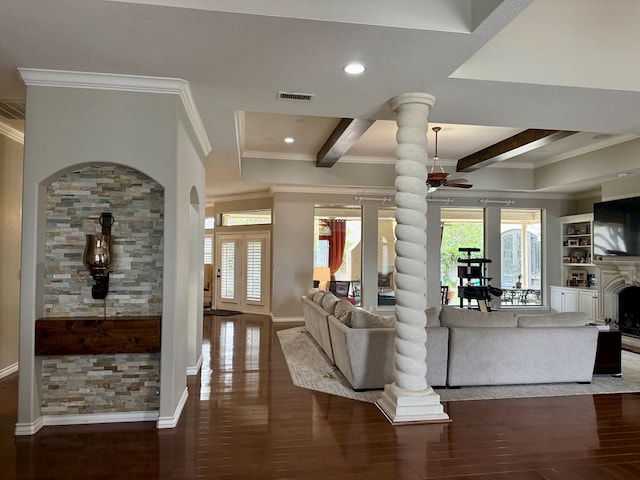 5 Muirfield Dr, Odessa, TX 79762 - living area with crown molding, ceiling fan, decorative columns, beam ceiling, and wood finished floors