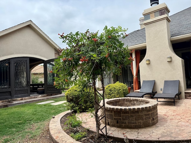 5 Muirfield Dr, Odessa, TX 79762 - view of patio featuring an outdoor fire pit