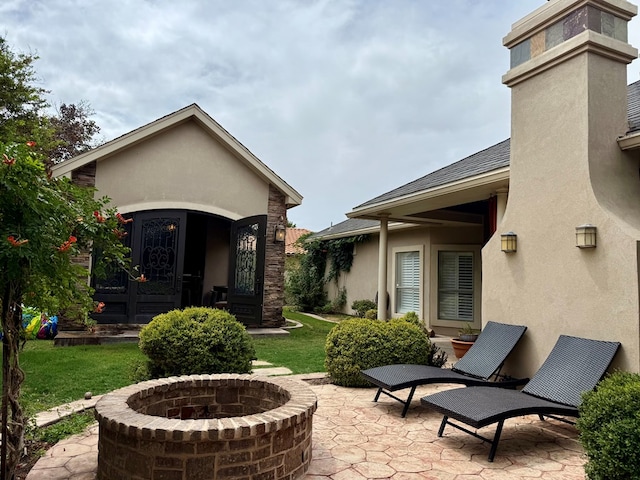 5 Muirfield Dr, Odessa, TX 79762 - view of patio / terrace with a fire pit