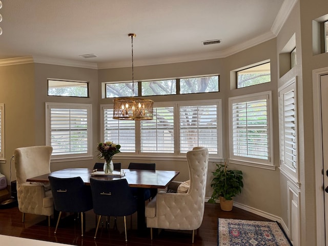 5 Muirfield Dr, Odessa, TX 79762 - dining area with a chandelier, wood finished floors, healthy amount of natural light, and ornamental molding